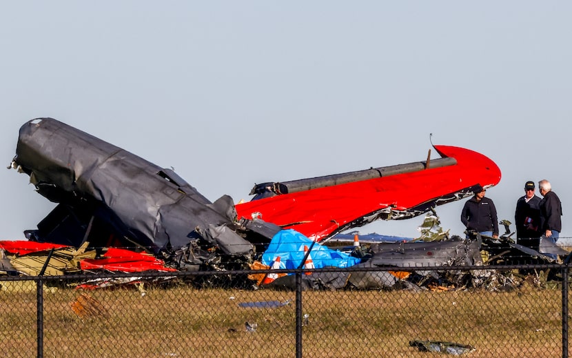 Officials, including those from the Federal Aviation Administration, survey damage from a...