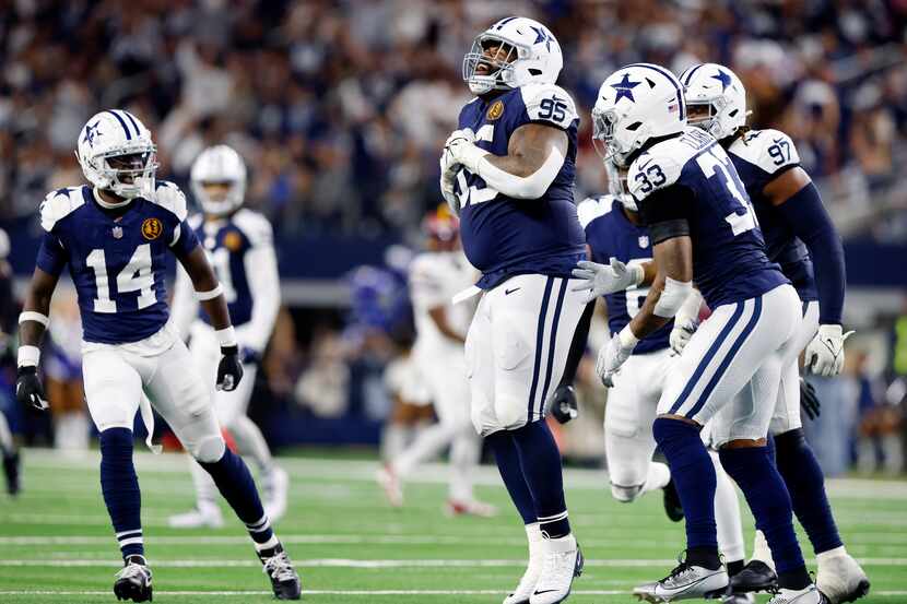 On a fourth down play, Dallas Cowboys defensive tackle Johnathan Hankins (95) celebrates his...