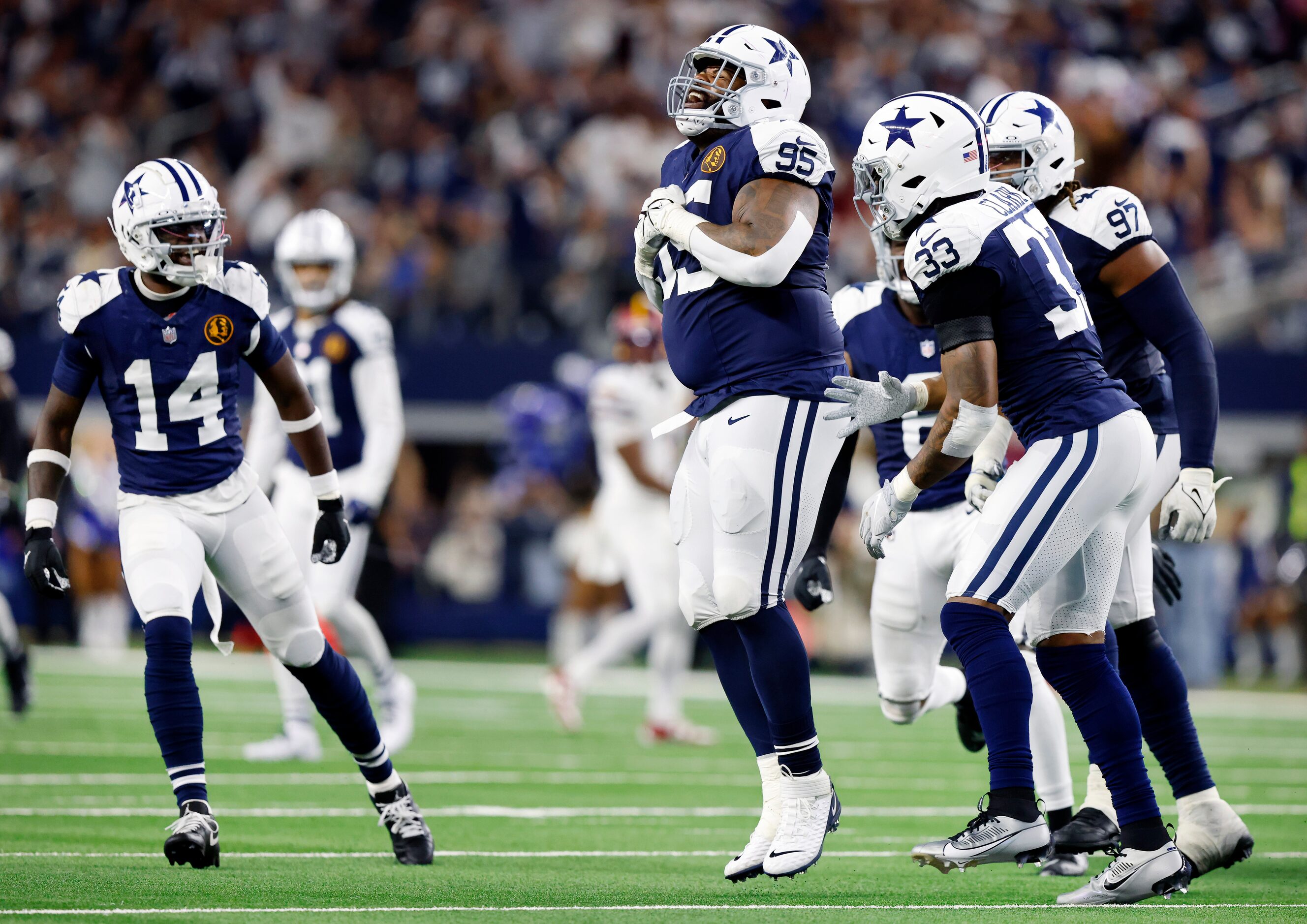 On a fourth down play, Dallas Cowboys defensive tackle Johnathan Hankins (95) celebrates his...