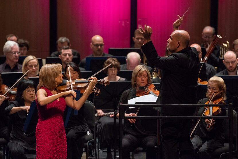 Emmanuelle Boisvert (left) performs Alban Berg's Concerto for violin and orchestra with the...