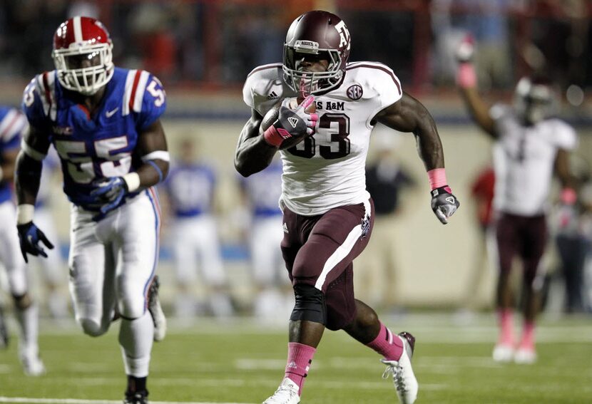 Texas A&M Aggies running back Christine Michael (33) runs through the Louisiana Tech...