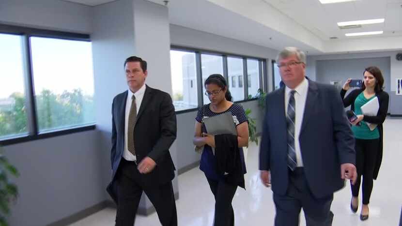 Sini Mathews leaves a court appearance Monday where she learned that her biological child, a...