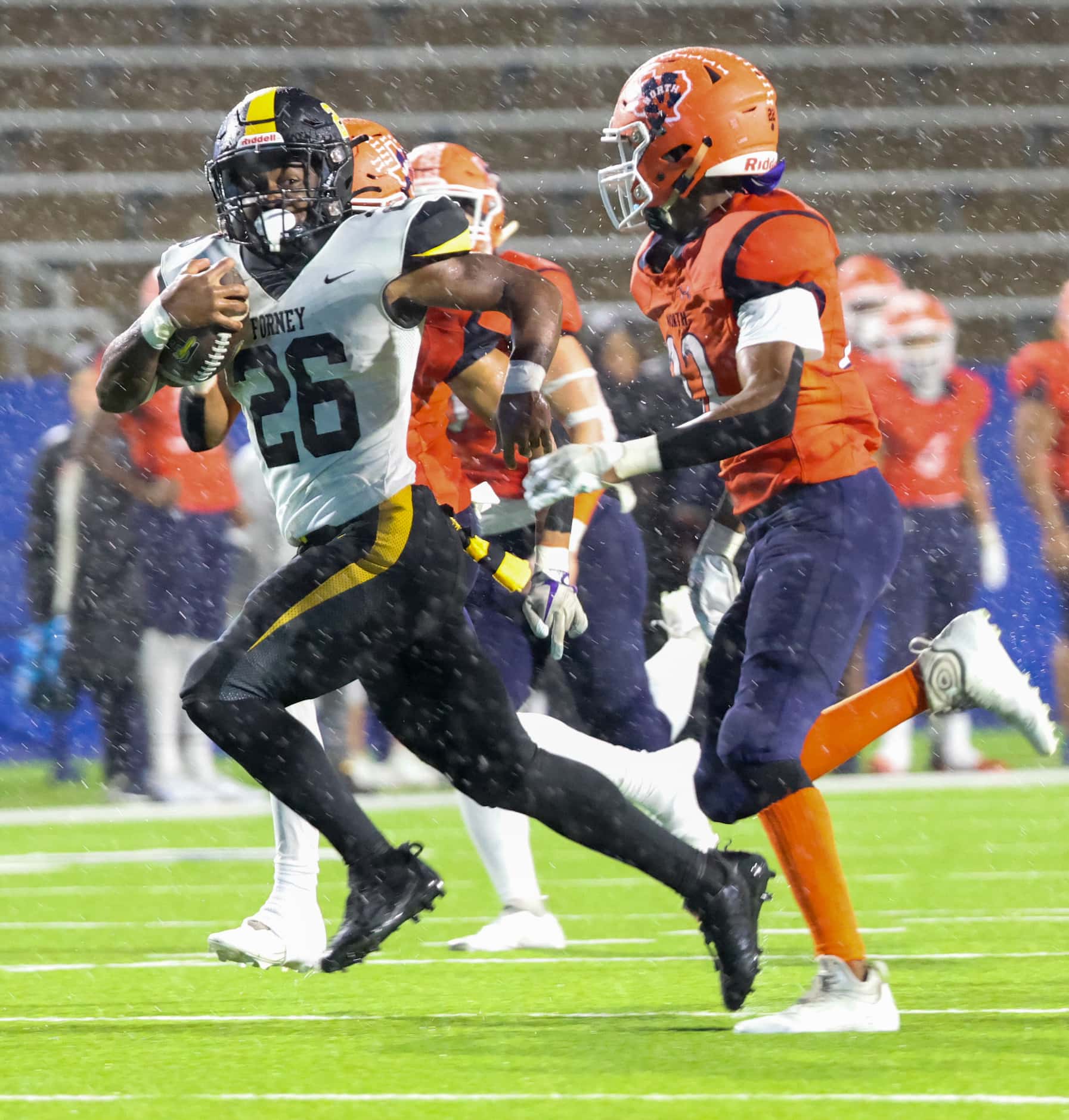 Forney running back Javian Osborne (26) looks to his left as he carries the ball downfield...