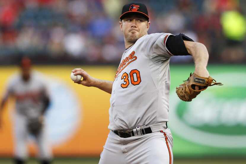 Baltimore Orioles starting pitcher Chris Tillman (30) pitches in a game against the Texas...