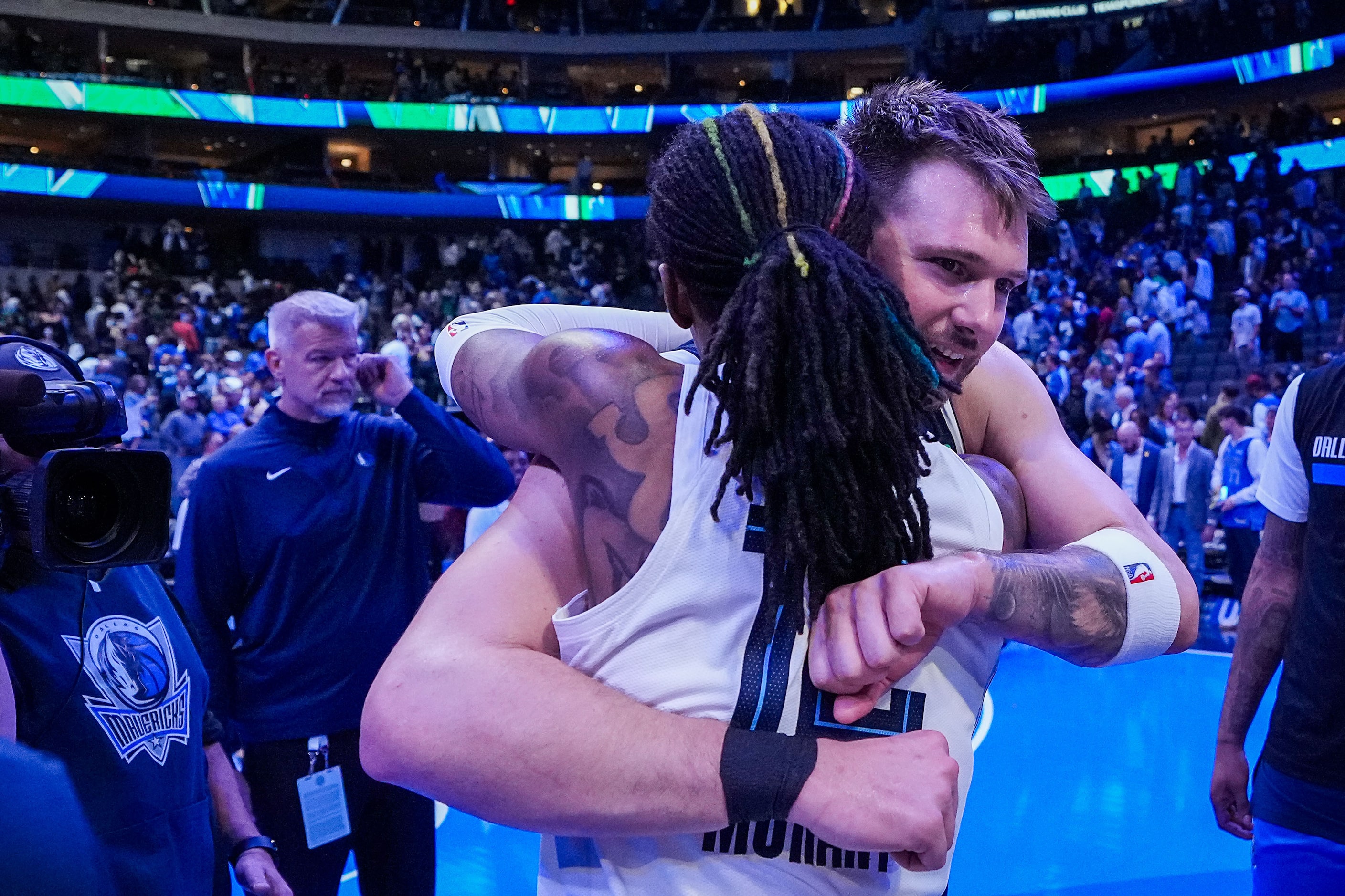 Dallas Mavericks guard Luka Doncic hugs Memphis Grizzlies guard Ja Morant (12) after the...