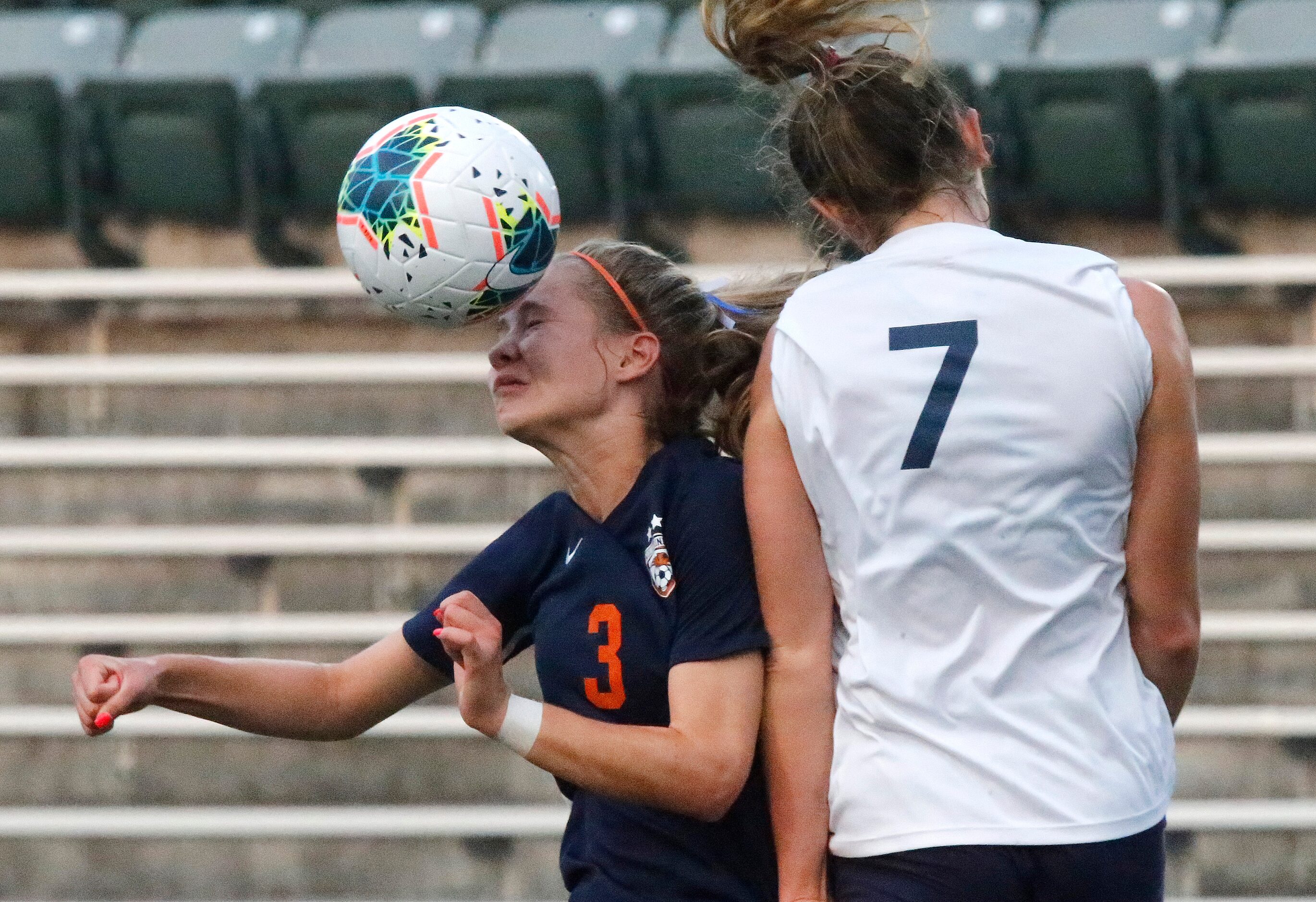 Wakeland midfielder Bella James (3) gets a header in front of Highland Park midfielder EmJ...