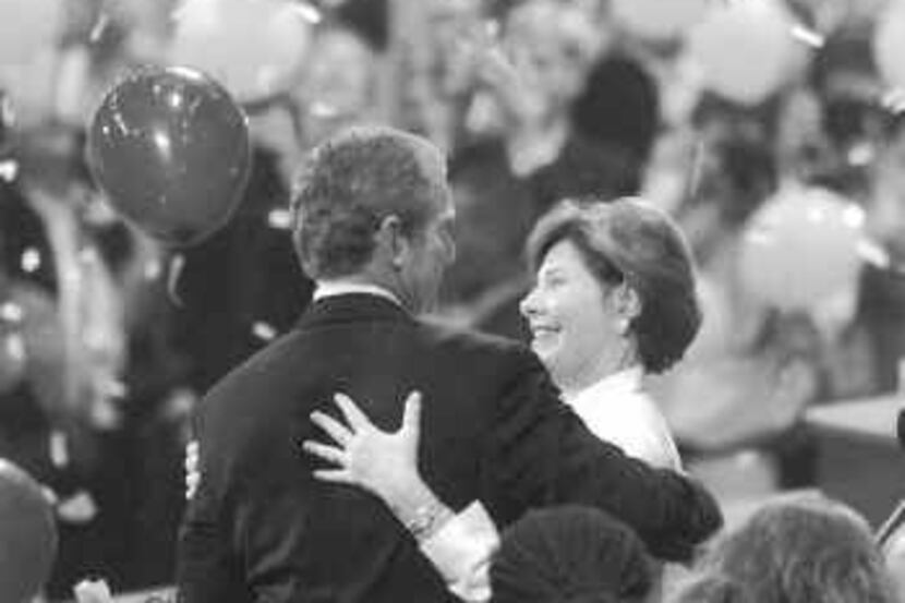  George W. Bush and wife Laura celebra- ted after he accepted the GOP nomina- tion in 2000....