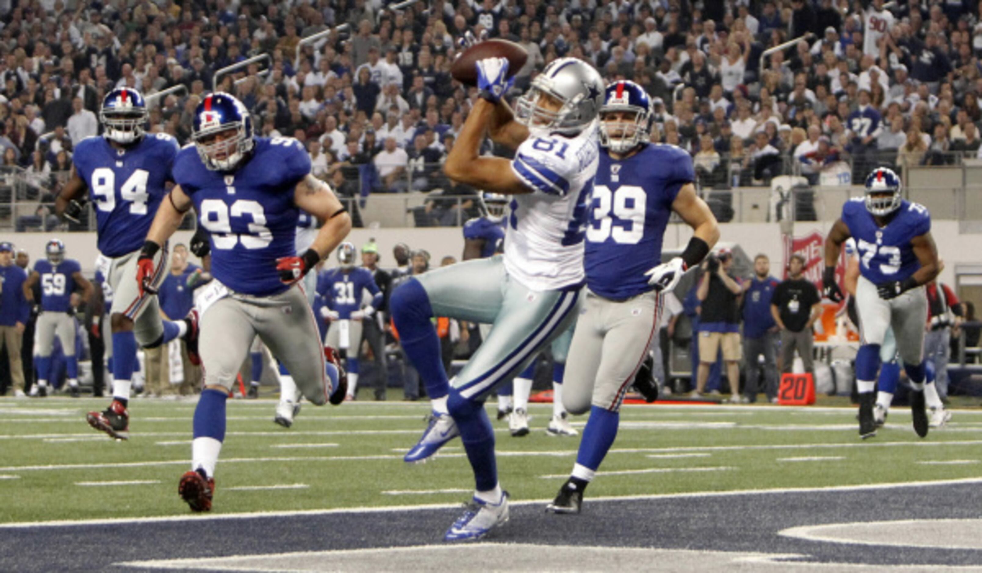 Dallas Cowboys wide receiver Laurent Robinson (81) is unable to bring in a  pass during an NFL football game against the Detroit Lions Sunday, Oct. 2,  2011, in Arlington, Texas. The Lions