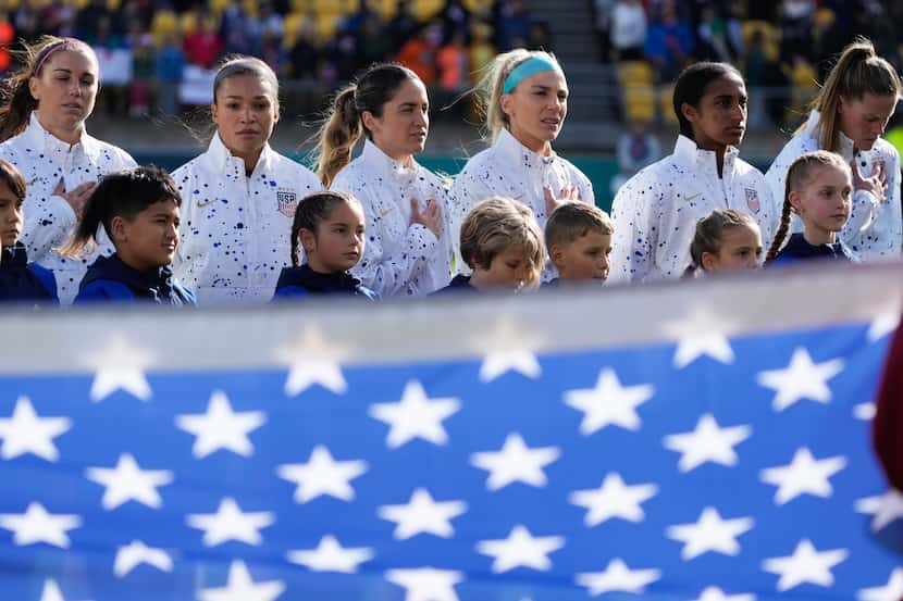 U.S. team sing their national anthem ahead of play in the Women's World Cup Group E soccer...