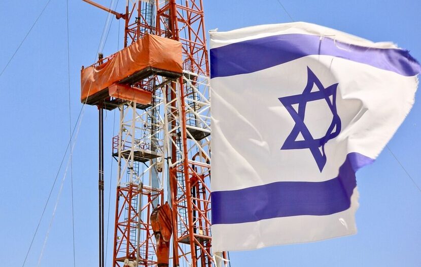 An Israeli flag flies next to the Megiddo-Jezreel #1 well drilled by Zion Oil & Gas. This is...