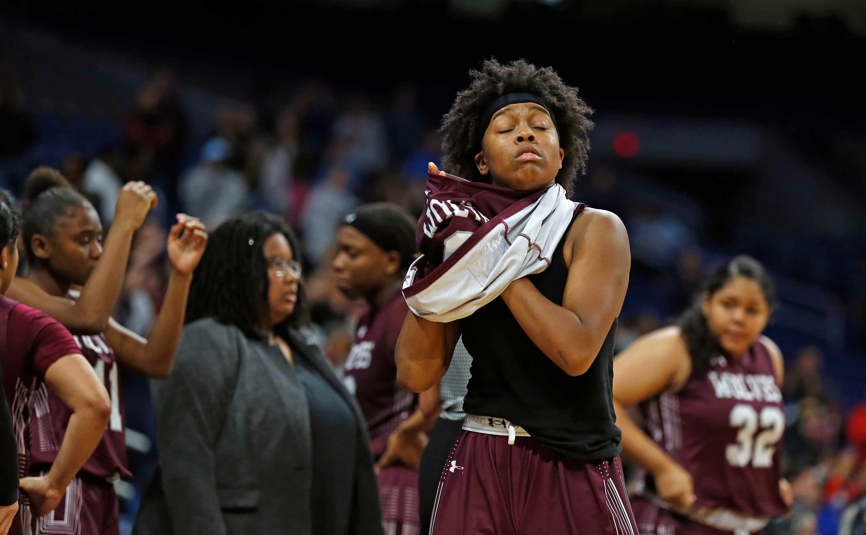 Mansfield Timberview guard Desiree Wooten #0 takes off her jersey at the end of the game in...