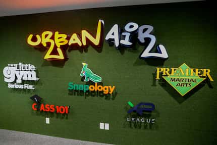 Logos of the companies that make up Unleashed Brands adorn a wall inside the parent firm's...