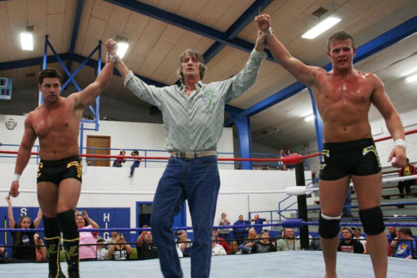Kevin Adkisson (center), better known as Kevin Von Erich, introduces sons Ross (left) and...