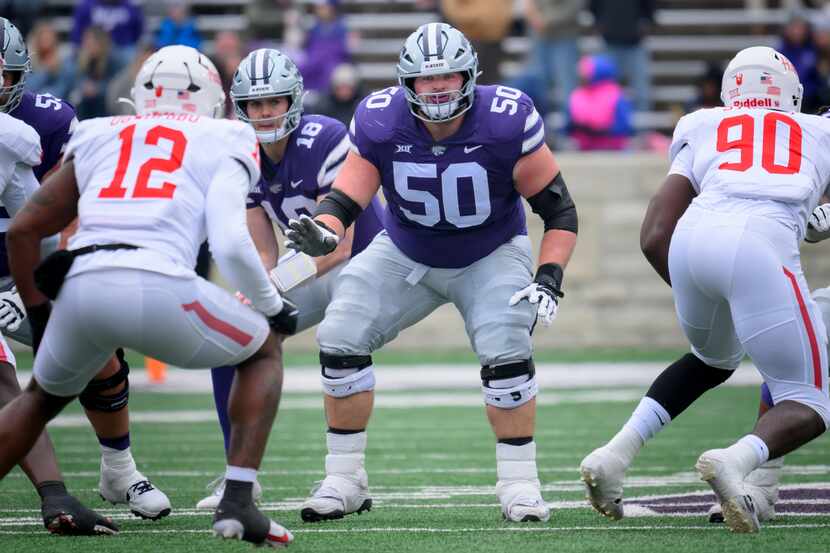 Kansas State offensive lineman Cooper Beebe (50) blocks during the first half of an NCAA...