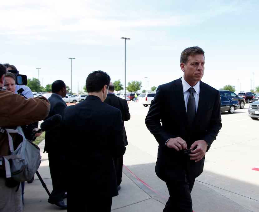 After talking with members of the media, former Dallas Cowboys player Troy Aikman enters the...