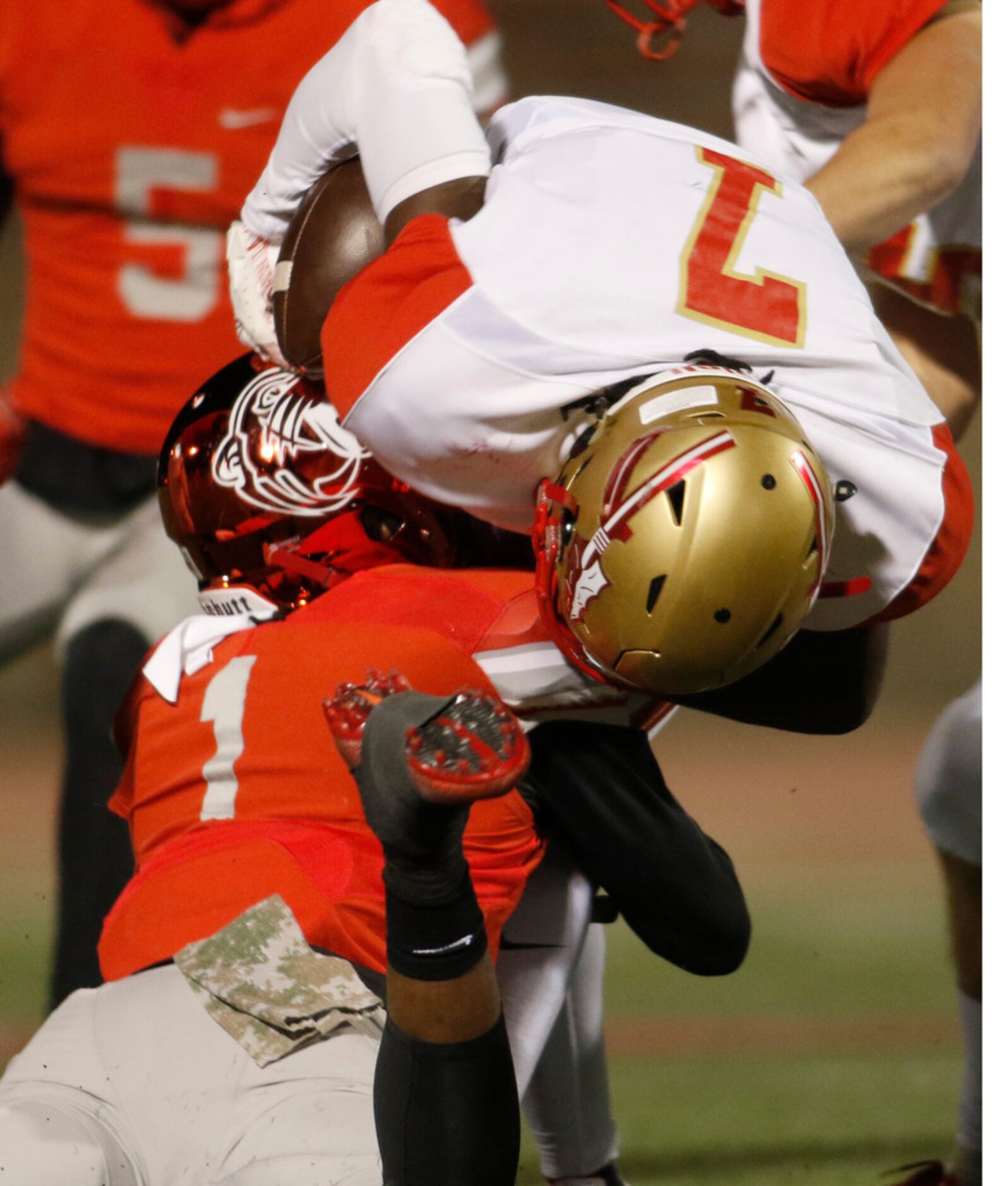 Duncanville defensive back Stacy Brown (1) delivers a hard hit to stop South Grand Prairie...