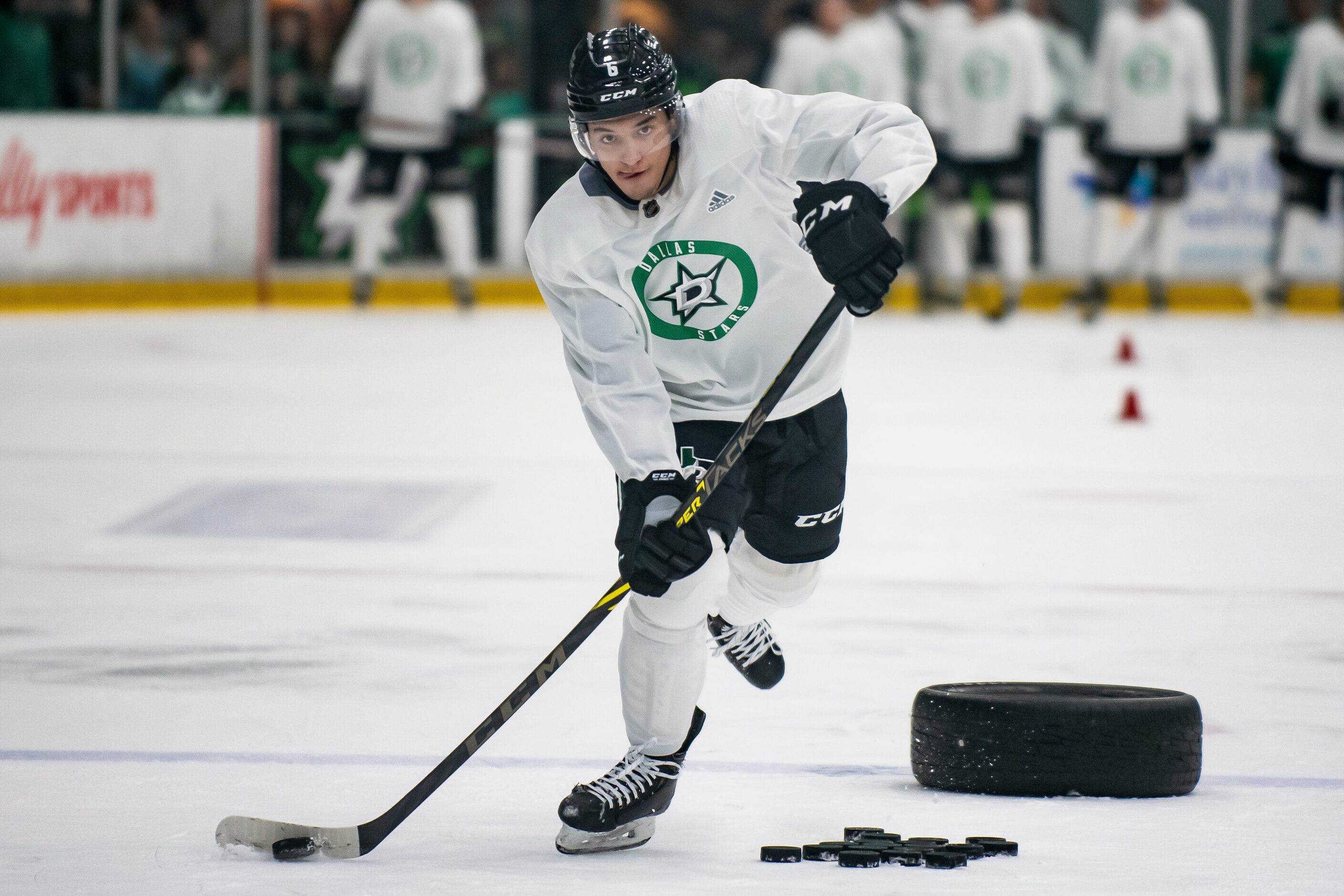 Defenseman Christian Kyrou (6) fires a shot at the goal while going through a drill during...