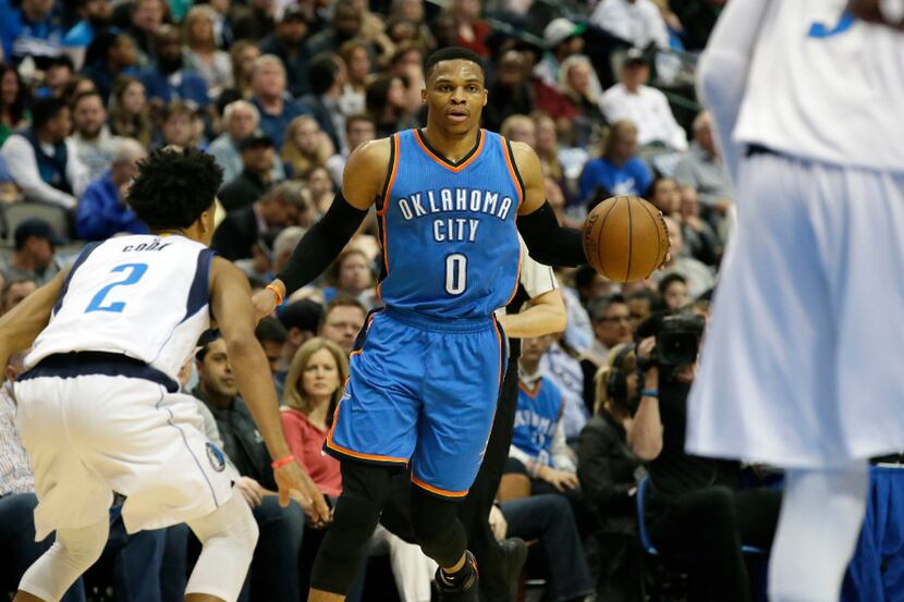 Oklahoma City Thunder guard Russell Westbrook (0) dribbles against Dallas Mavericks guard...