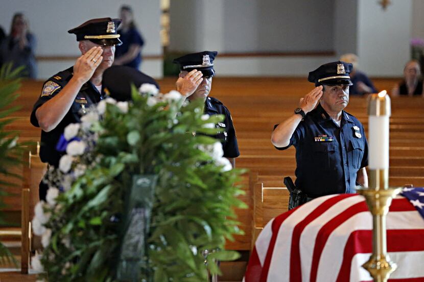 Members of the Boston Police Department salute the casket of slain Dallas police Sgt....