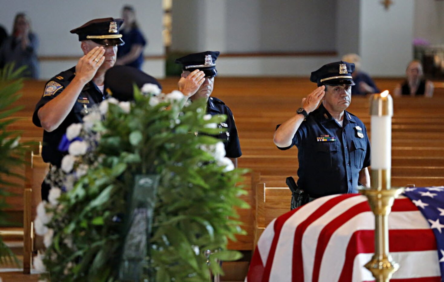 Members of the Boston Police Department salute the casket of slain Dallas police Sgt....