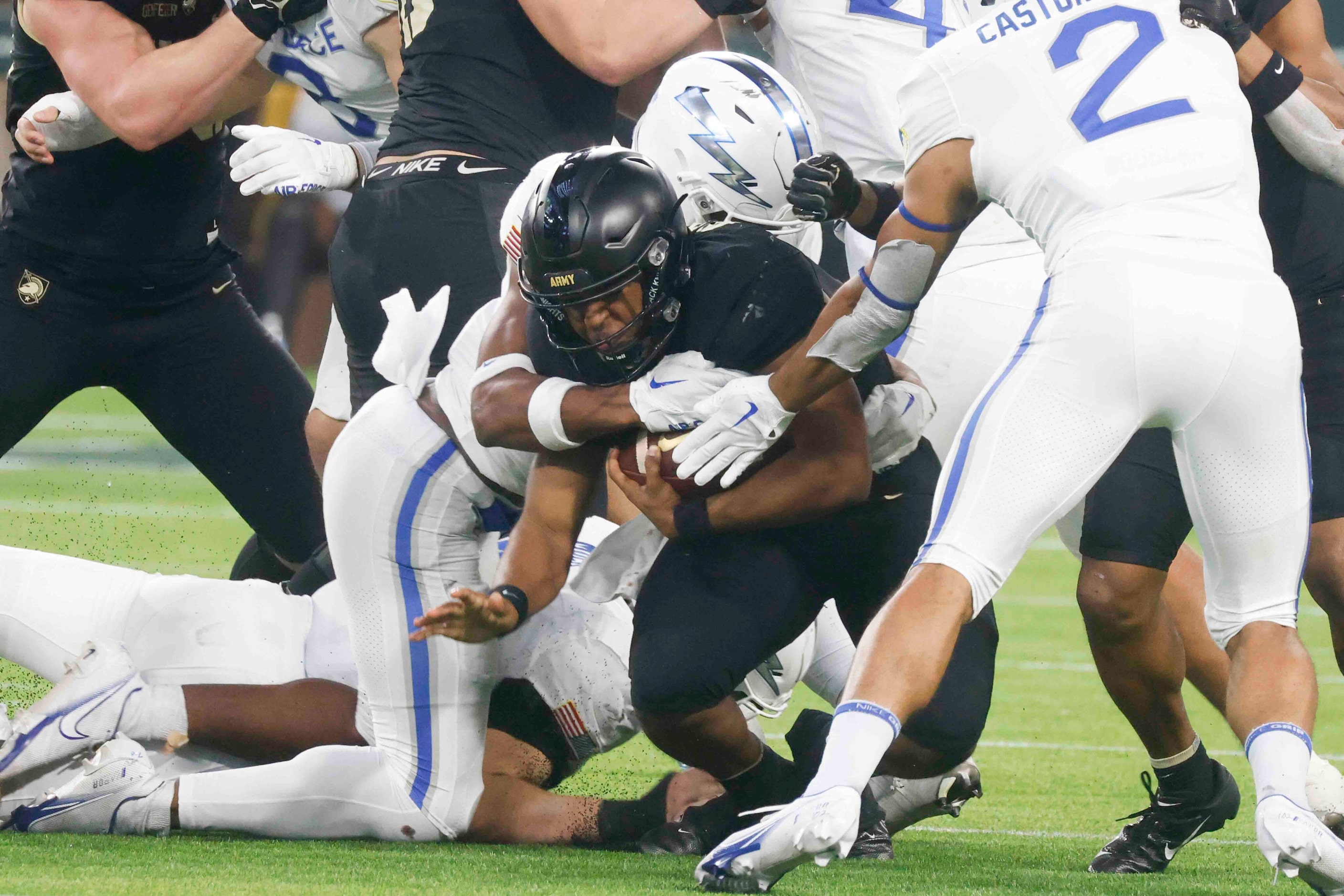 Army quarterback Jemel Jones (7) gets tackled during the second half of an NCAA football...