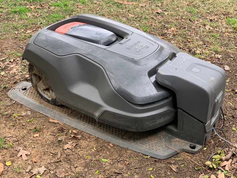The Husqvarna Automower 315X in its charging base.