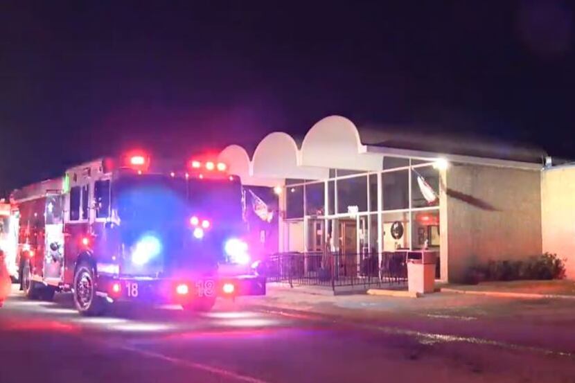 A fire truck sits outside a nursing home where fire broke out Tuesday morning in White...