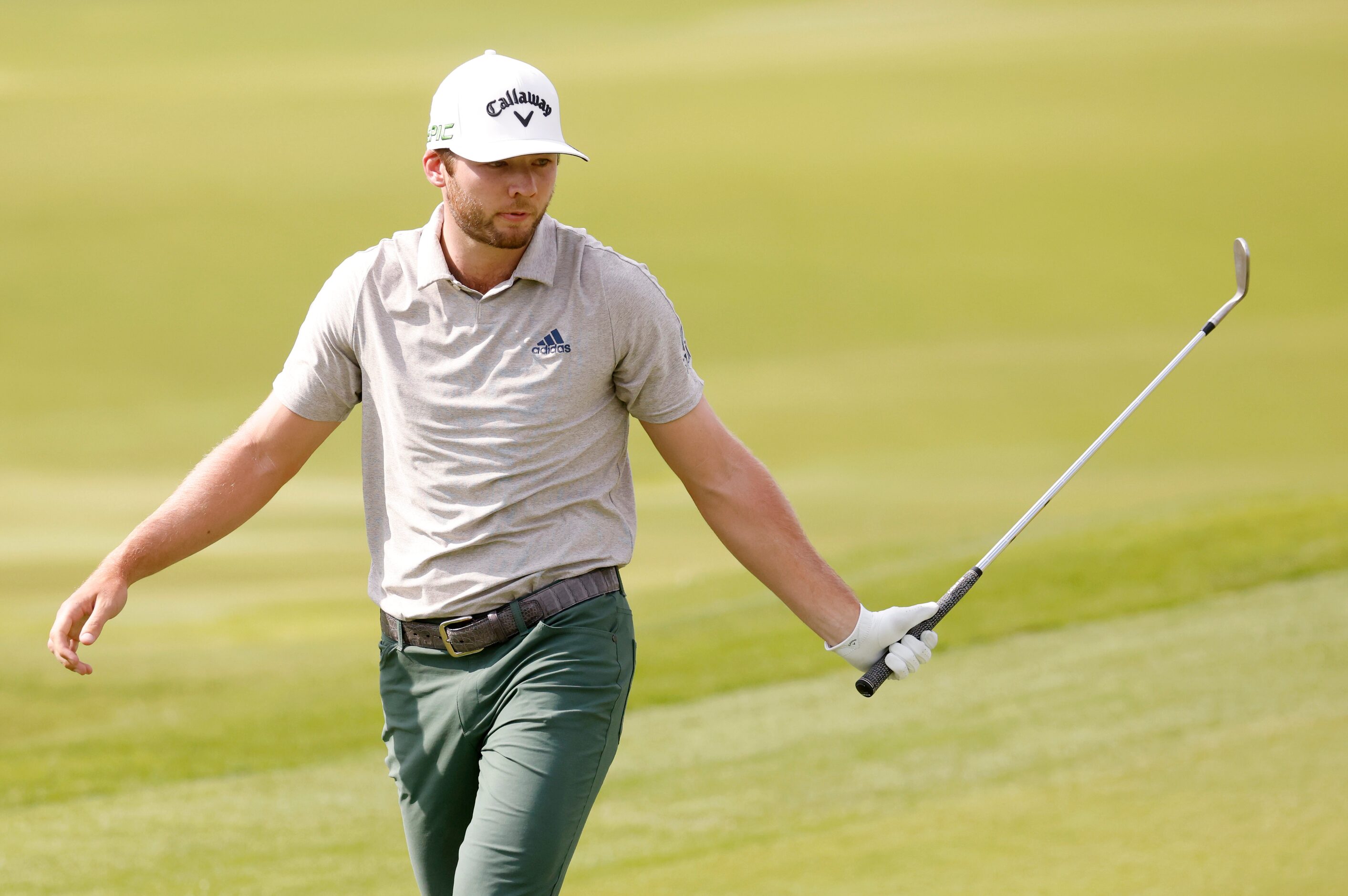 Sam Burns reacts after barely missing a putt for a birdie on the 16th hole during round 3 of...