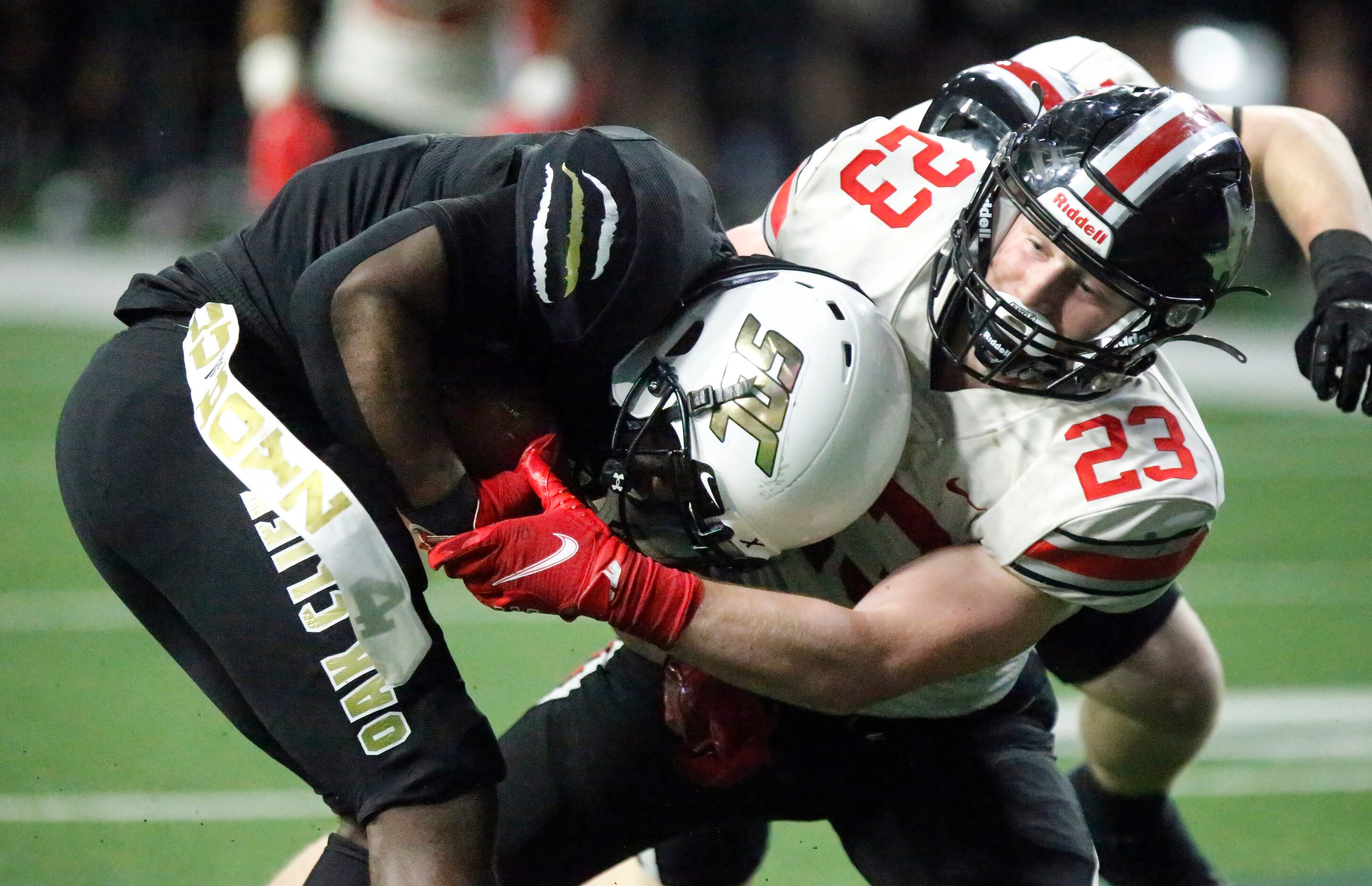 Lovejoy High School safety Brock Bernal (23) tackles South Oak Cliff High School wide...