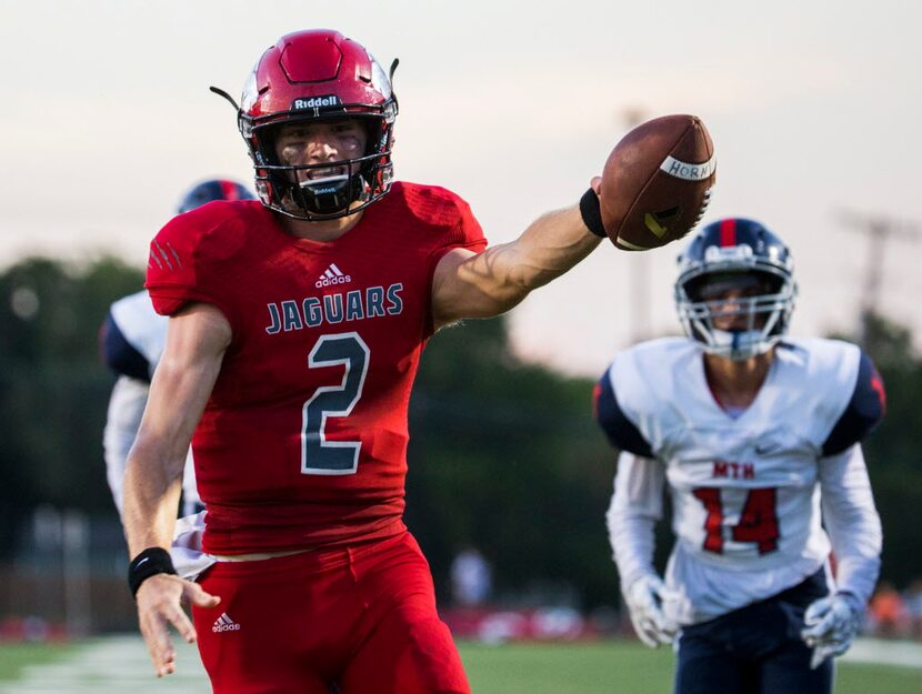 Mesquite Horn quarterback Chris Robison (2) runs the ball in to the end zone for a touchdown...