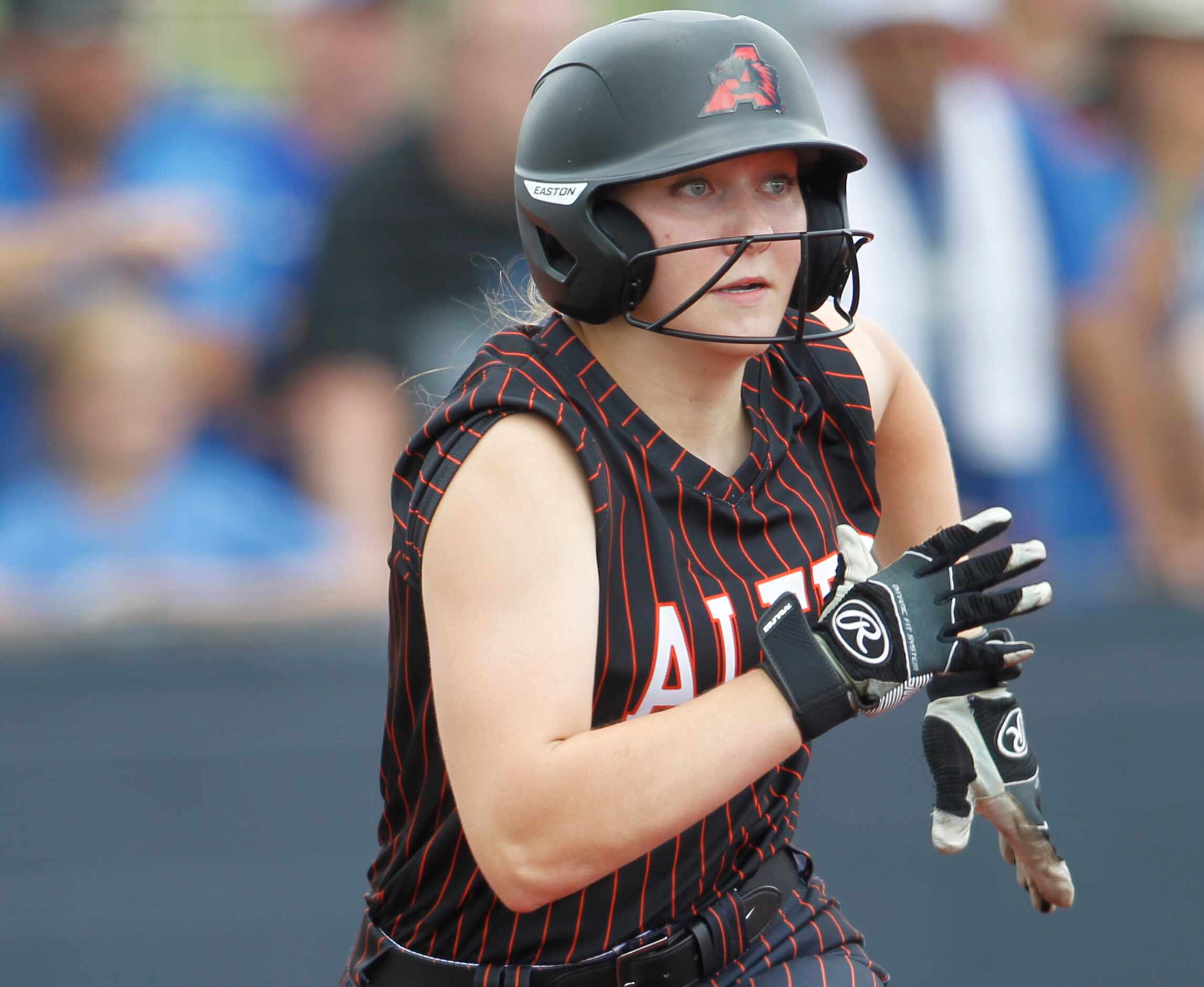 Aledo outfielder Marissa Powell (11) bolts out of the batter's box after connecting for a...