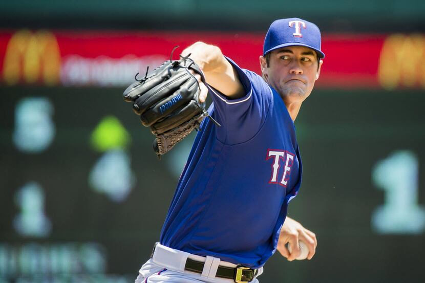 Texas Rangers starting pitcher Cole Hamels pitches during the first inning against the...