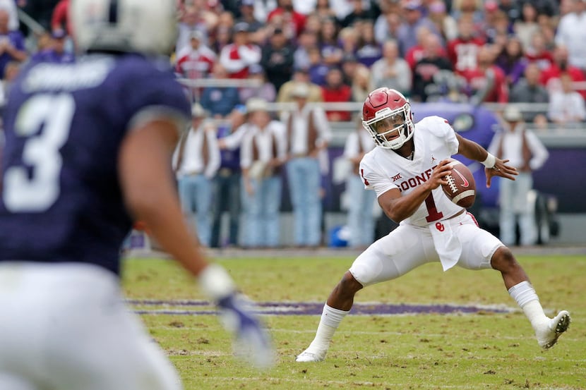 FILE - Oklahoma quarterback Kyler Murray (1) scrambles out of the pocket in the second...