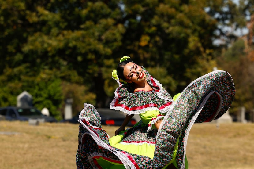 Yaretzi Flores performs a folklorico piece during Day of the Dead celebration, on Saturday,...