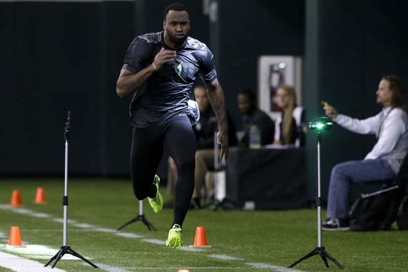Baylor defensive back Ahmad Dixon runs the 40-yard dash during pro day for NFL football...