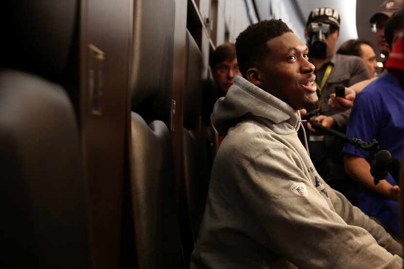 Dallas Cowboys defensive end David Irving talks to the media during locker room clean out at...