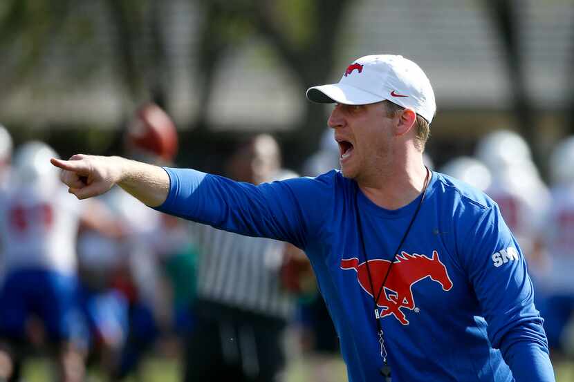 Former SMU offensive coordinator Rhett Lashlee yells during the first spring practice of the...