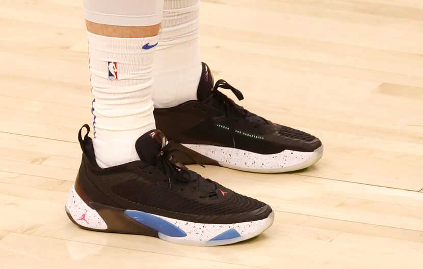 Dallas Mavericks guard Luka Doncic (77)  wears his signature shoes Luka 1 in a game against...