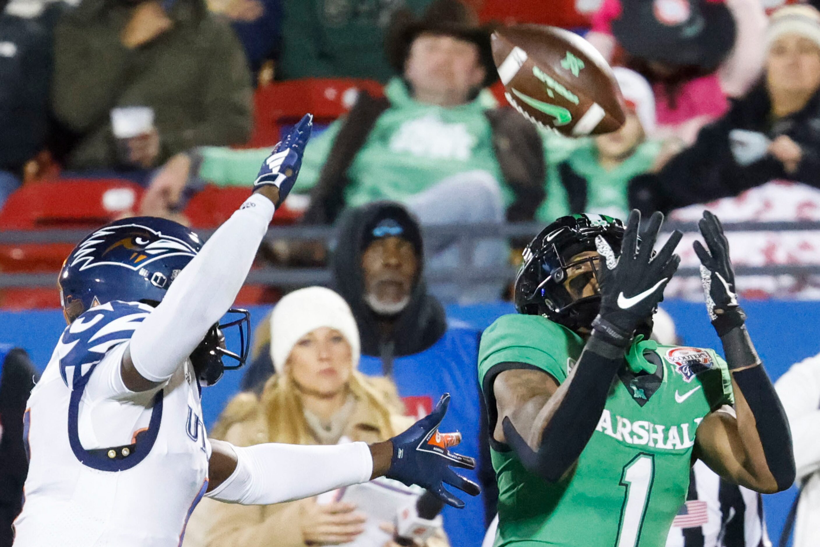 Marshall wide receiver Talik Keaton (right) attempts to catch a pass past UTSA cornerback...