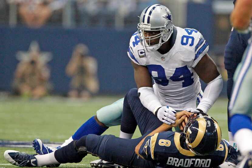 Dallas Cowboys defensive end DeMarcus Ware (94) breaks a Dallas Cowboys sack record with...