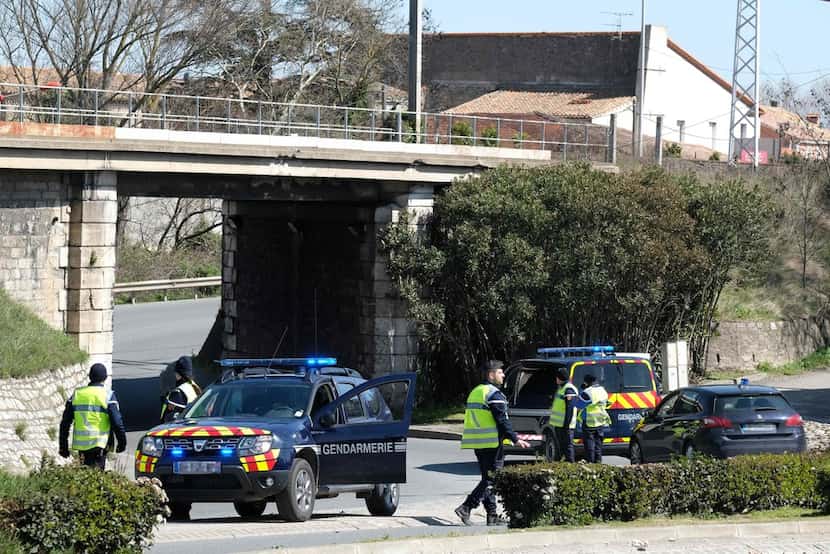 French gendarmes block the access to Trebes, where a man took hostages at a supermarket on...