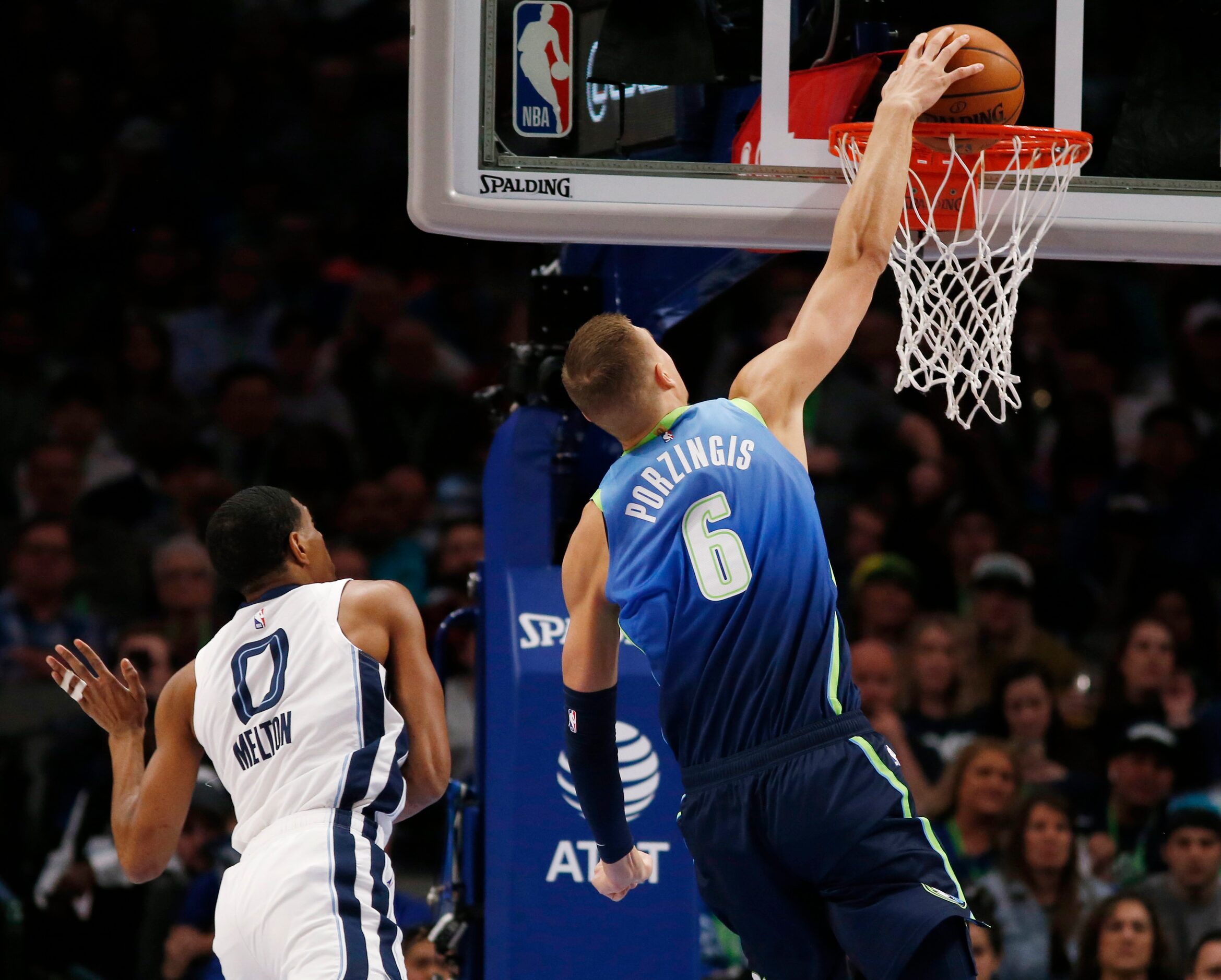 Dallas Mavericks forward Kristaps Porzingis (6) dunks the ball in front of Memphis Grizzlies...