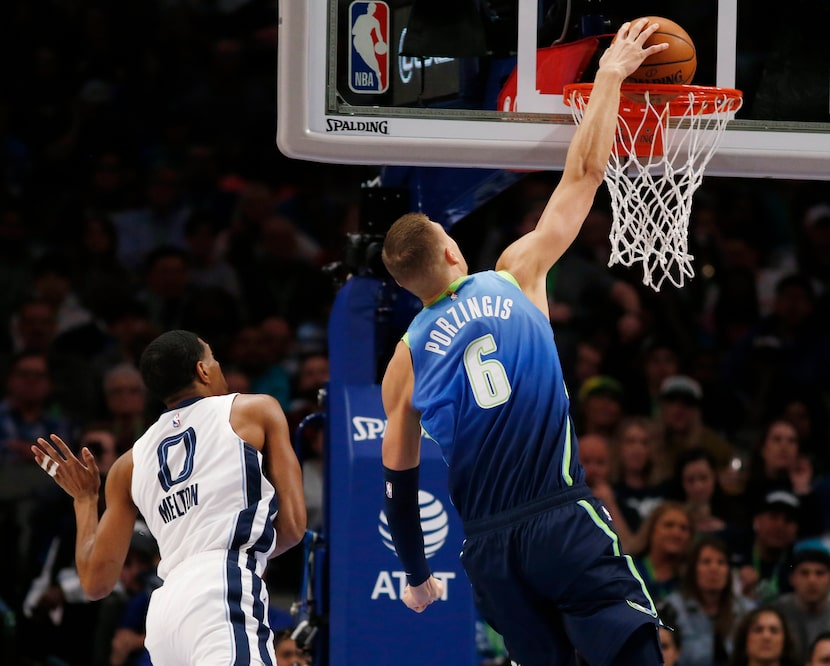 Dallas Mavericks forward Kristaps Porzingis (6) dunks the ball in front of Memphis Grizzlies...