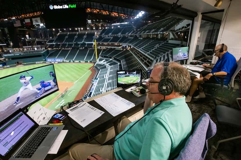 Texas Rangers broadcasters Matt Hicks, left, and Eric Nadel announce the game between the...