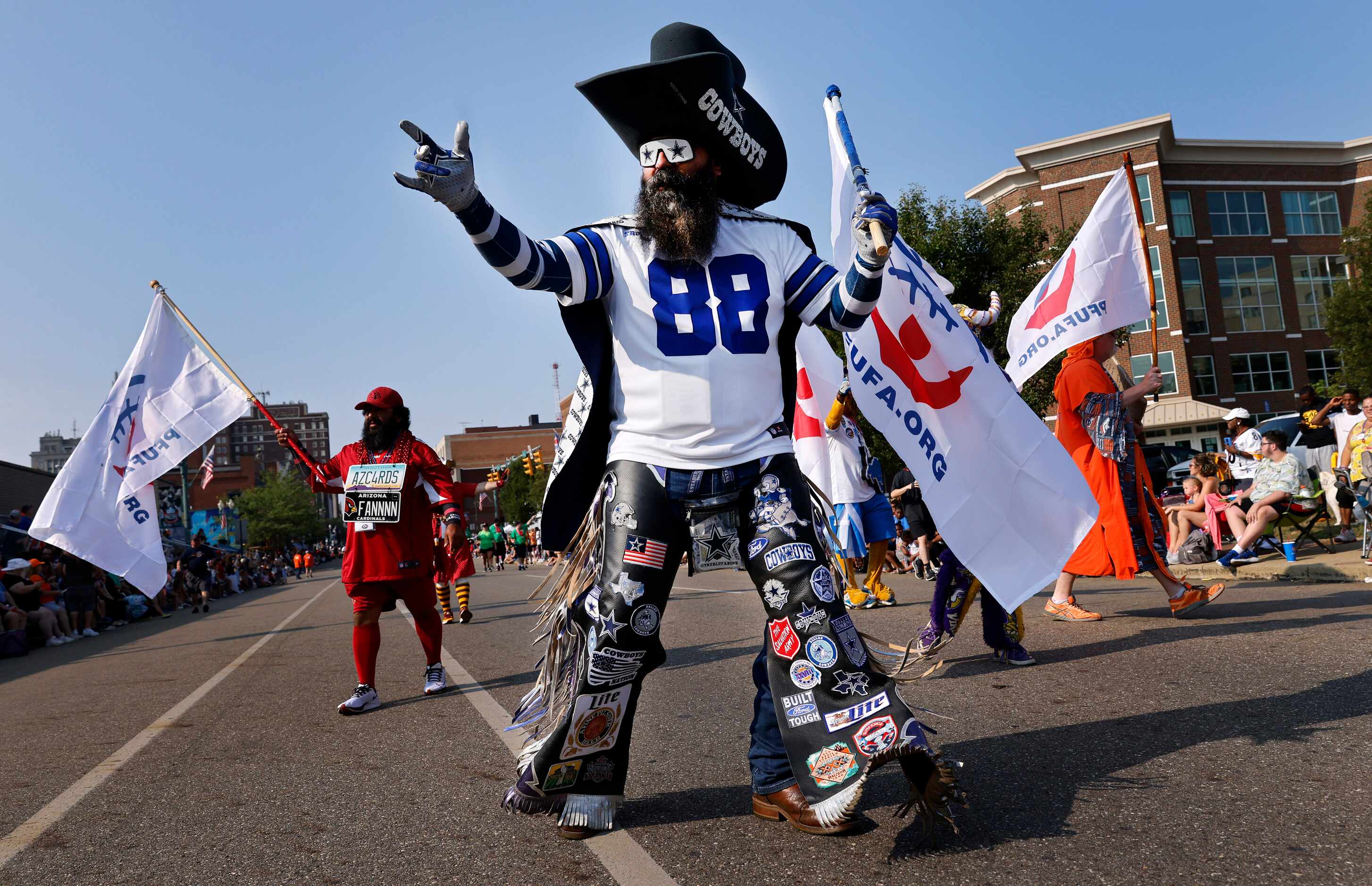 Dallas Cowboys fan Shane Wentz of Grove City, Pennsylvania marches with other NFL mascots in...