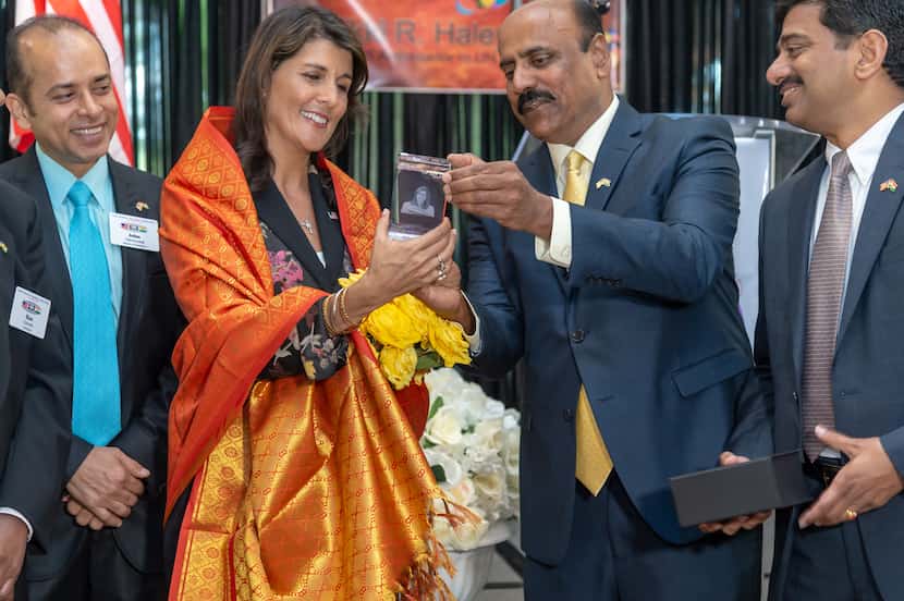 Dr. Prasad Thotakura hands a memento of appreciation to Nikki Haley, U.S. Ambassador to the...