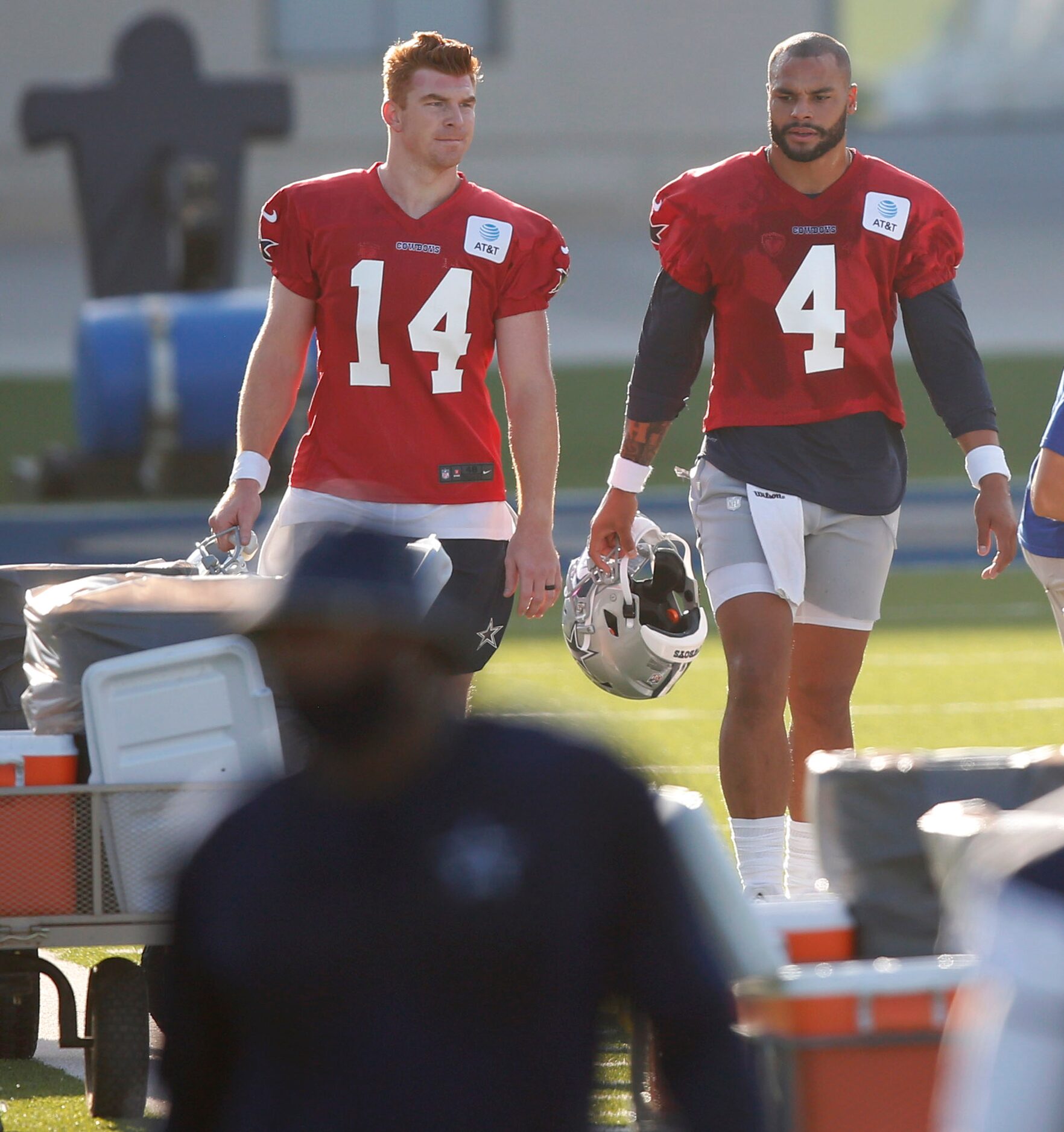 Dallas Cowboys quarterback Andy Dalton (14) and Dallas Cowboys quarterback Dak Prescott (4)...