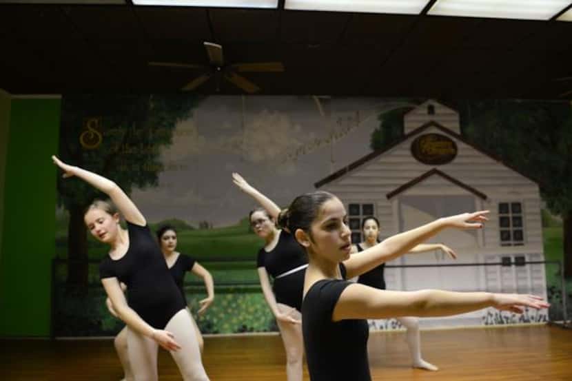 Carlee Baladez, 14, practices ballet at Stage Door Dance ballet studio.