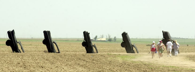 Tourists visit Ant Farm's Cadillac Ranch, west of Amarillo. In 2003, the vehicles were...