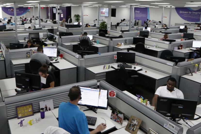 Teladoc customer service representatives work in the Lewisville office call center on...